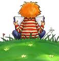 Boy reading on a hill 